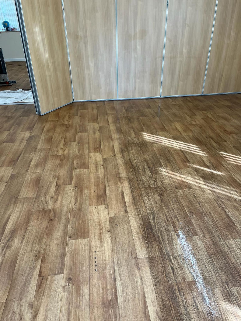 A bedroom floor showing a Fresh Tech cleaned area against an untreated area